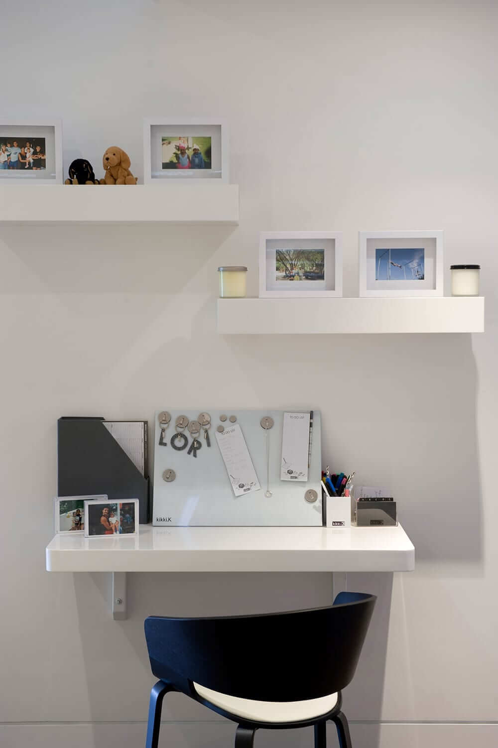 Blue chair in front of a small home office desk